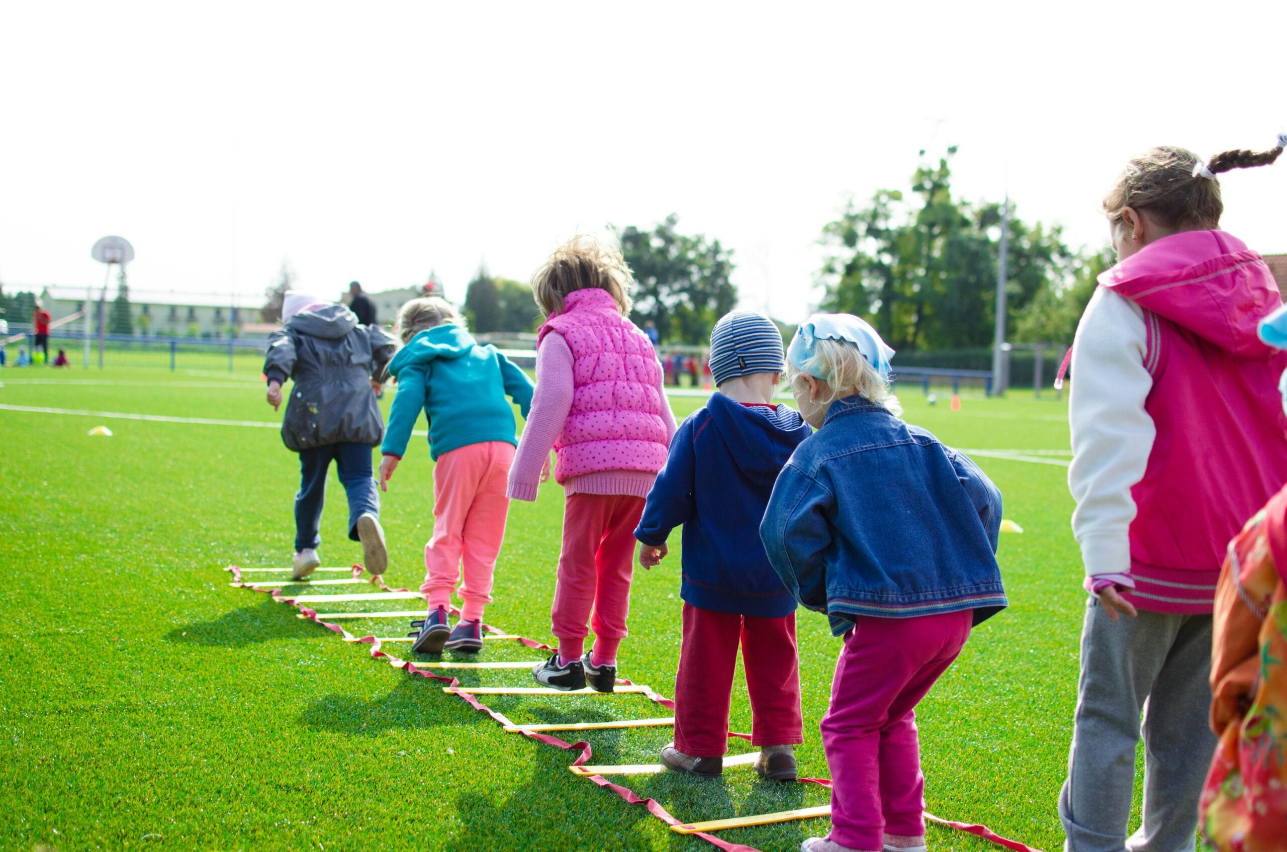 Children engaging in a physical agility activity at school.