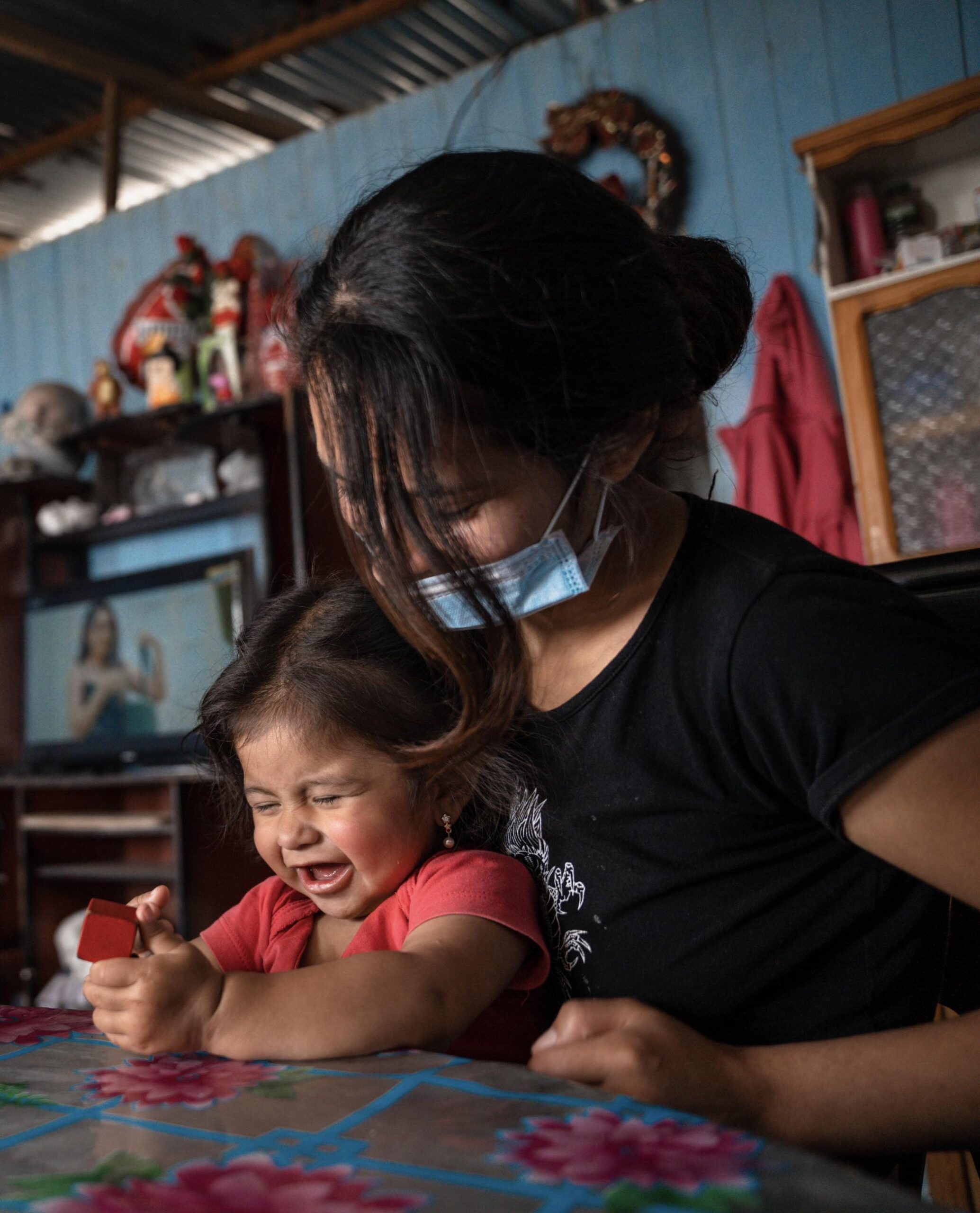 A young girl completes a task for her development evaluation in Lima, Peru, on August 24, 2022. Socios En Salud/Monica Mendoza